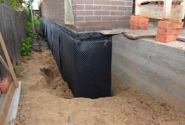 Happy homeowners after waterproofing job in Crofton
